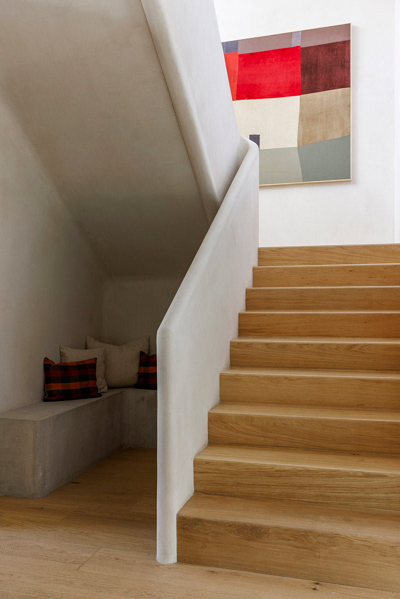 MADERA's custom oak stair treads create a striking architectural statement in this light-filled contemporary home.