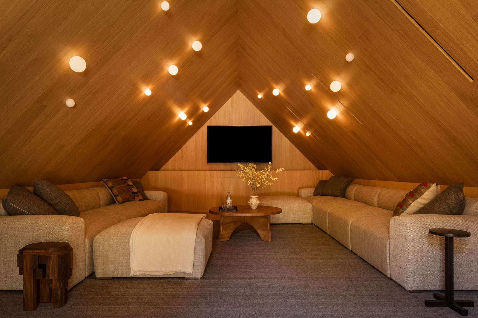 MADERA's vaulted oak ceiling creates an intimate, enveloping atmosphere in this cozy media room retreat.