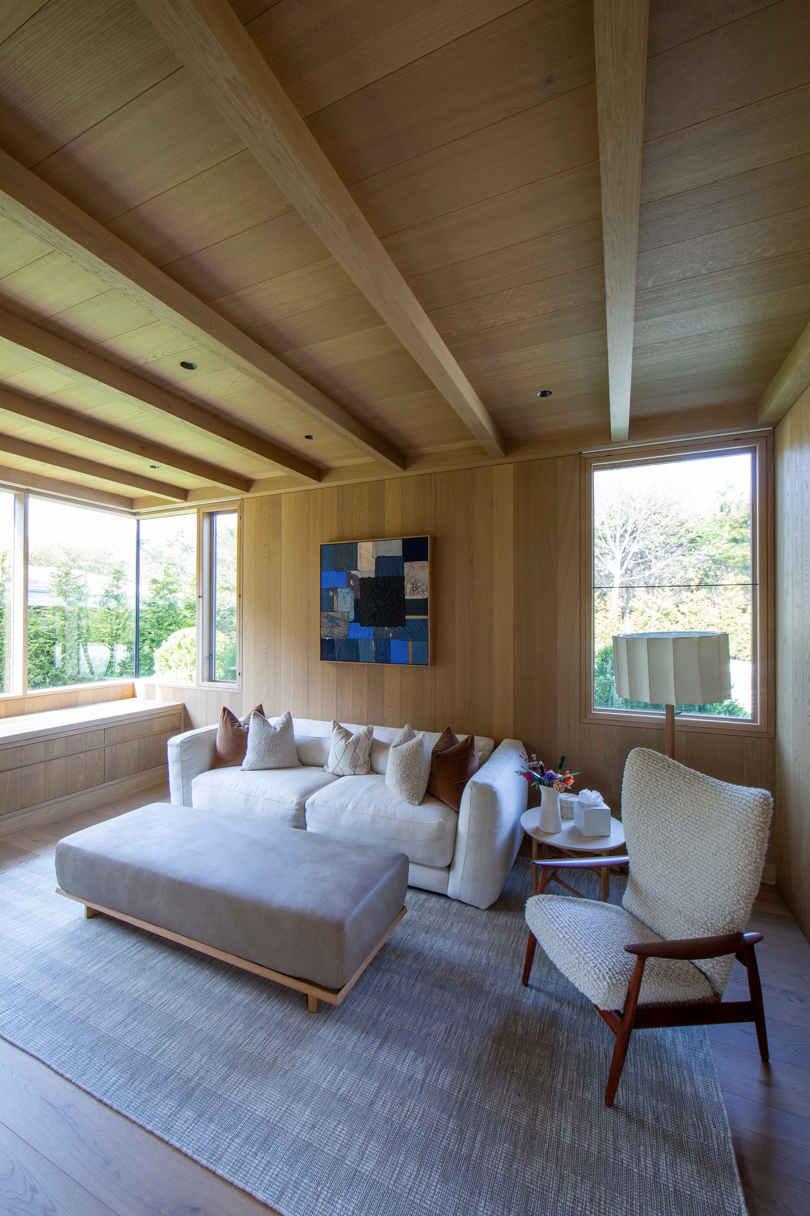 Wood beams and built-in window seating by MADERA define this intimate reading nook with natural character.